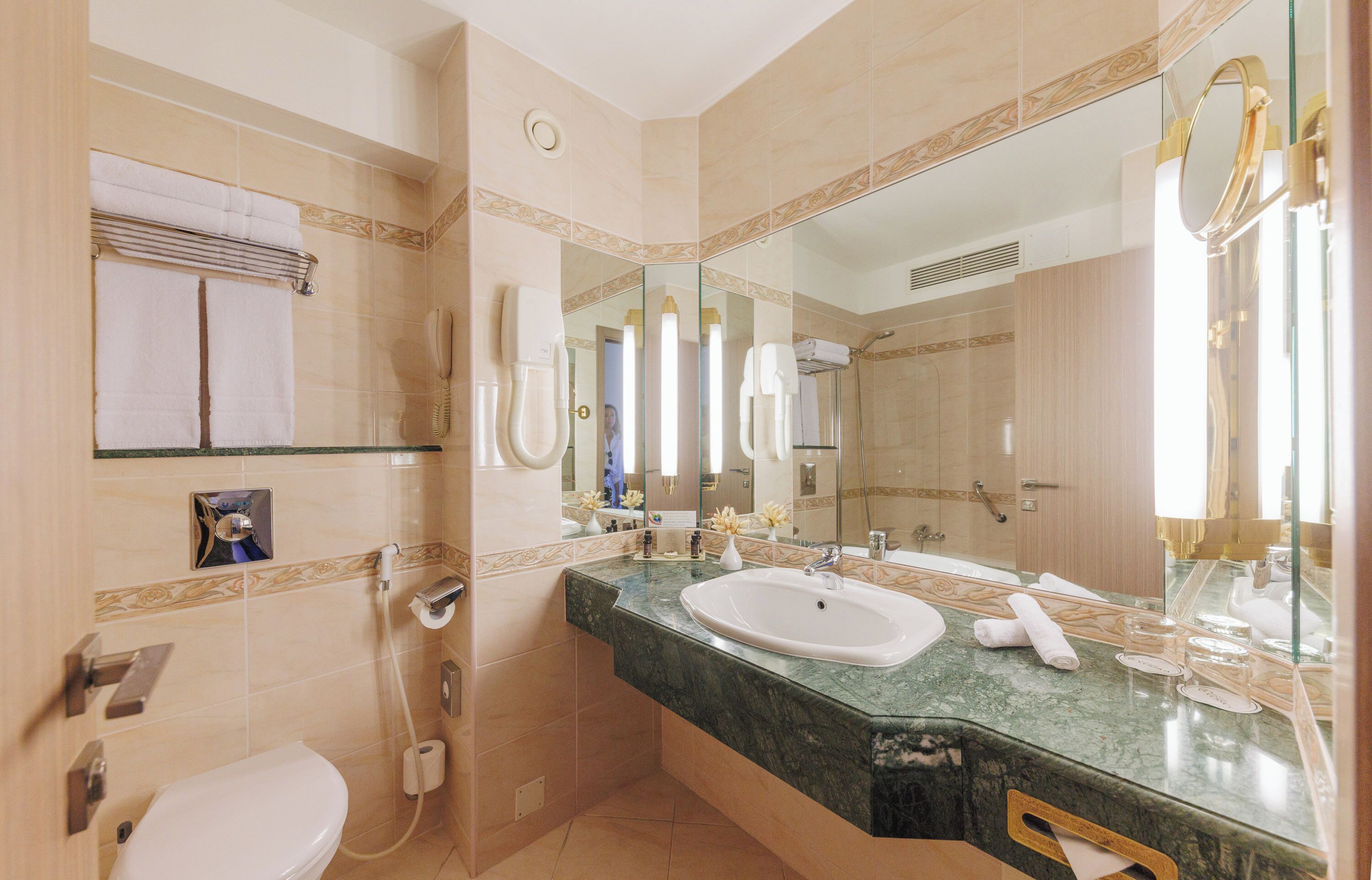 eco-friendly toiletries, hair dryer, bathrobes, slippers