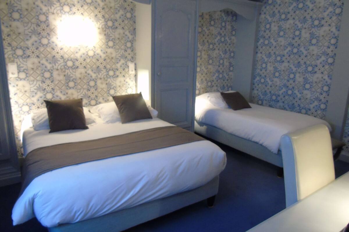 family room, multiple beds, bathtub, garden view | in-room safe, desk, soundproofing, cots/infant beds