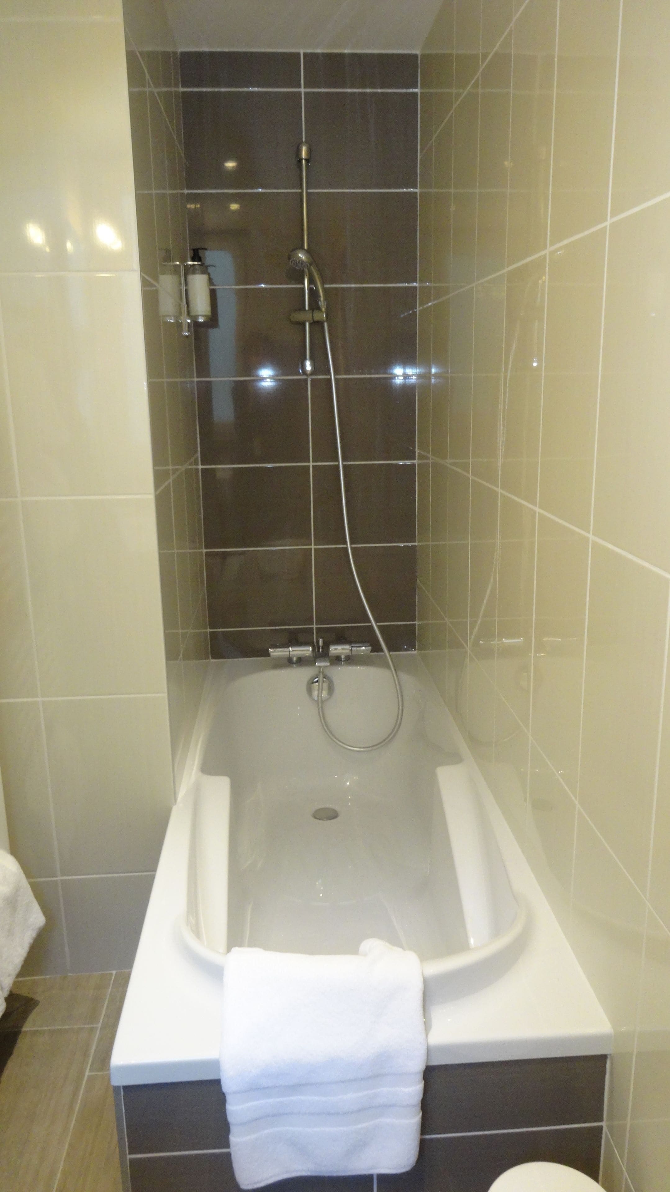 family room, multiple beds, bathtub, garden view | bathroom | free toiletries, hair dryer, towels