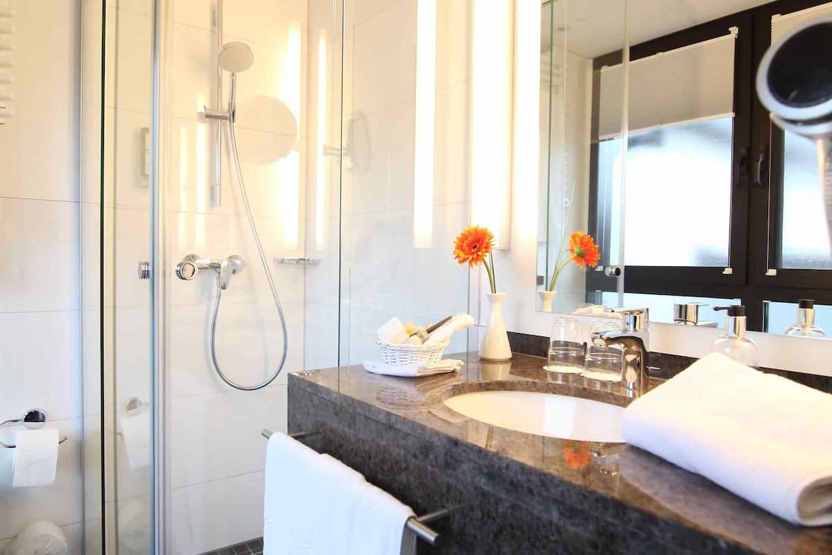 comfort room, 1 double bed | bathroom | separate bathtub and shower, designer toiletries, hair dryer, bathrobes