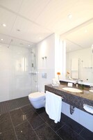 Separate tub and shower, designer toiletries, hair dryer, bathrobes