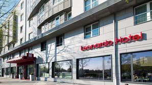 A hotel with a modern facade, large windows, and a prominent "Leonardo Hotel" sign. - Leonardo Hotel Munich City Olympiapark (Munich)
