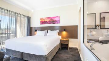 Suite, 1 King Bed, Jetted Tub (Spa Suite) | 1 bedroom, premium bedding, down comforters, pillowtop beds
