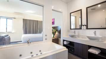 Suite, 1 King Bed, Jetted Tub (Spa Suite) | Bathroom | Shower, free toiletries, hair dryer, towels