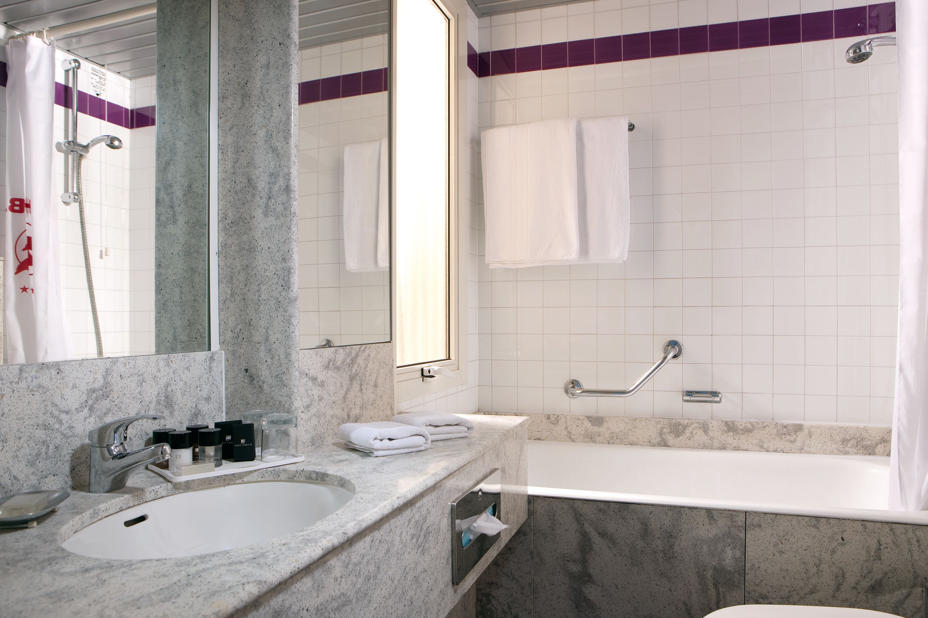 combined shower/bathtub, designer toiletries, hair dryer, bidet