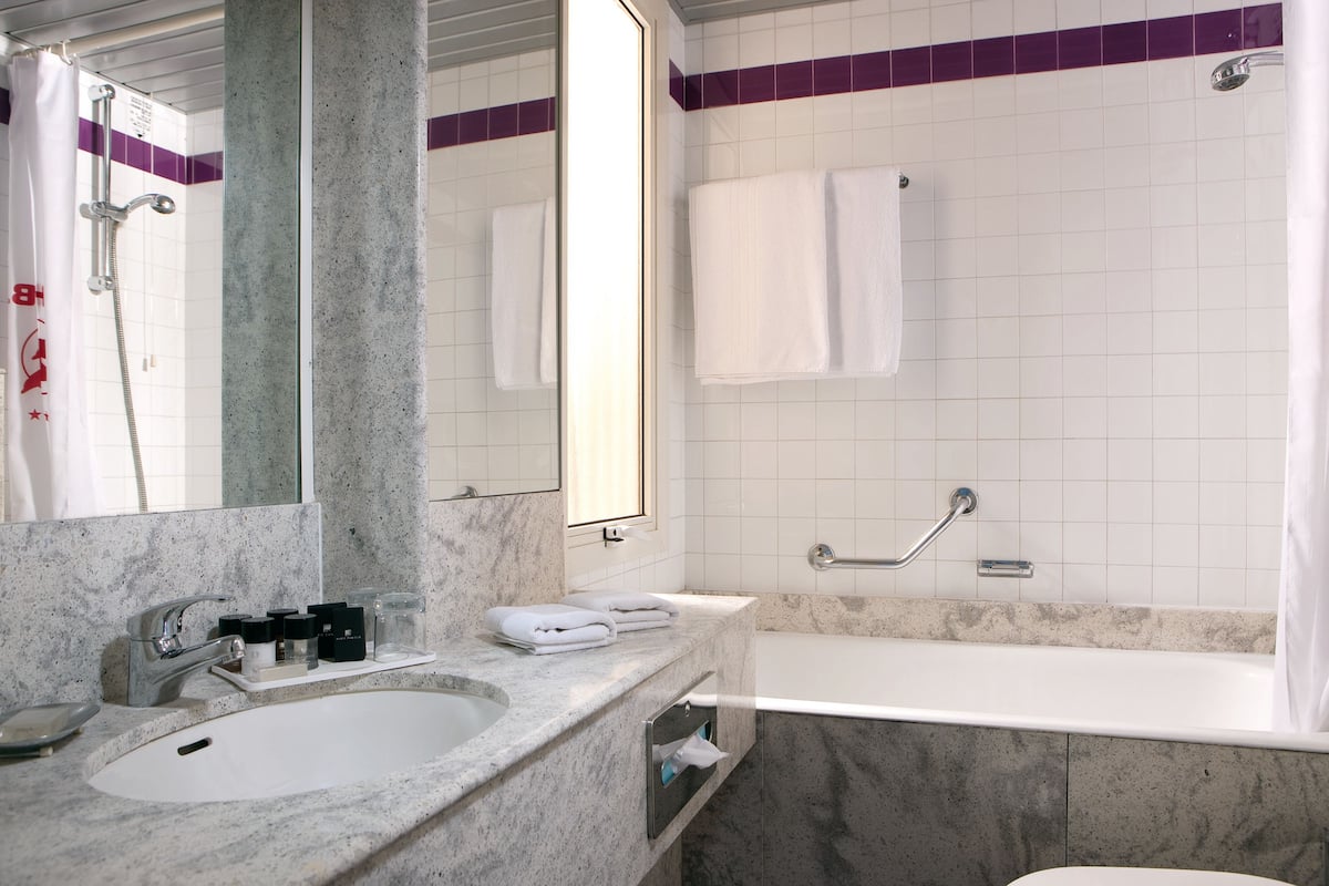 combined shower/bathtub, designer toiletries, hair dryer, bidet