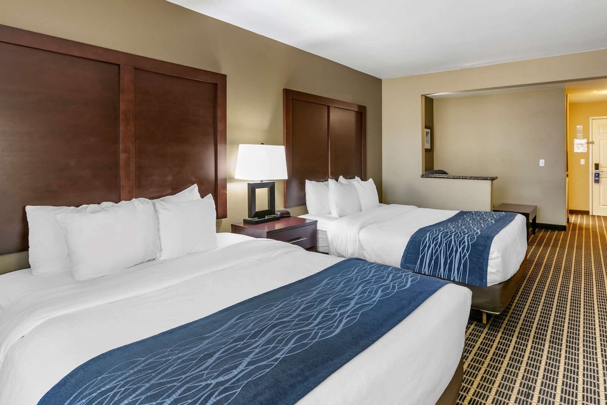 Premium bedding, laptop workspace, blackout drapes, soundproofing