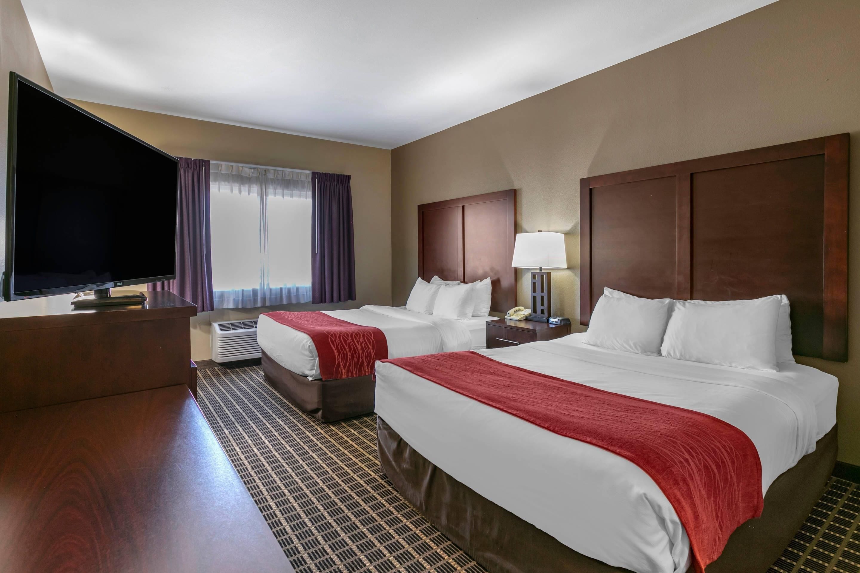 Premium bedding, laptop workspace, blackout drapes, soundproofing