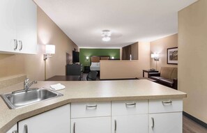 Full-sized fridge, microwave, stovetop, coffee/tea maker