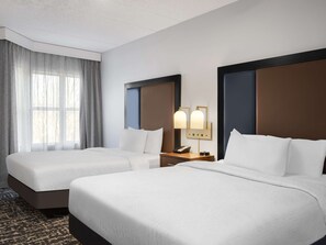 Down duvets, pillow-top beds, in-room safe, desk