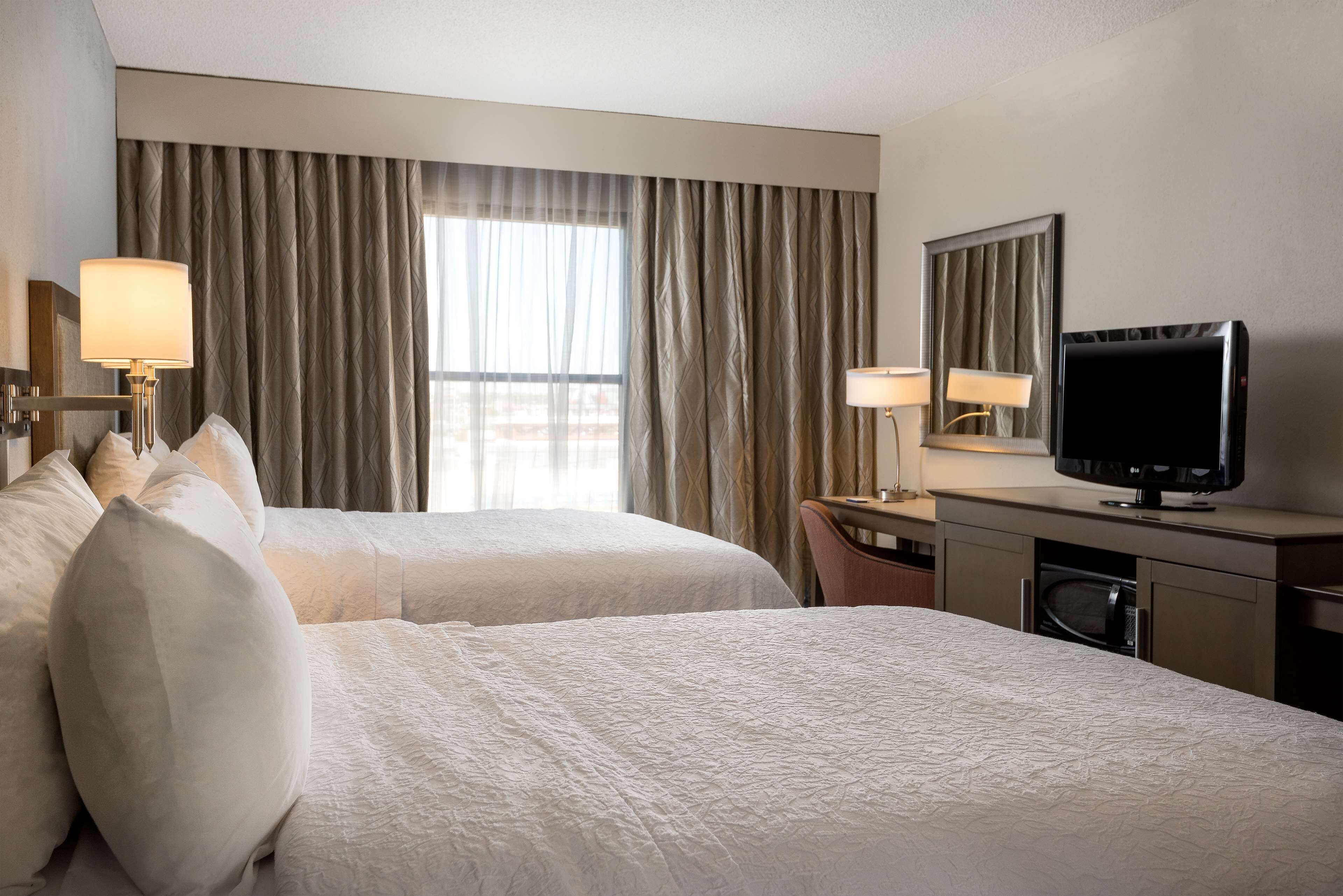 room, 2 queen beds, non smoking | in-room safe, desk, iron/ironing board, free cots/infant beds