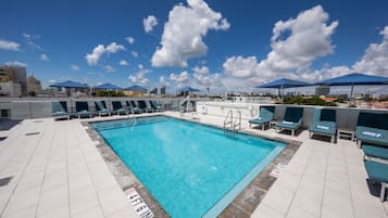 Outdoor pool, pool umbrellas, sun loungers