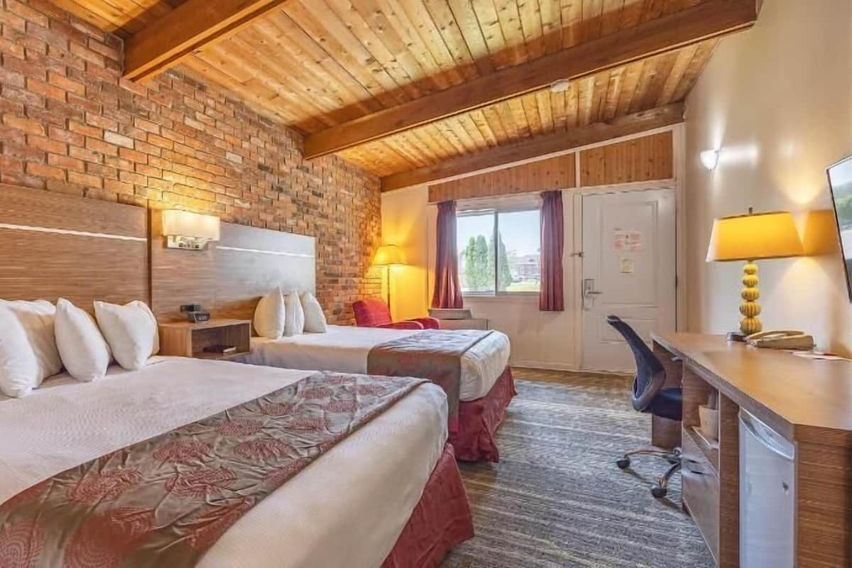 Premium bedding, desk, laptop workspace, blackout drapes