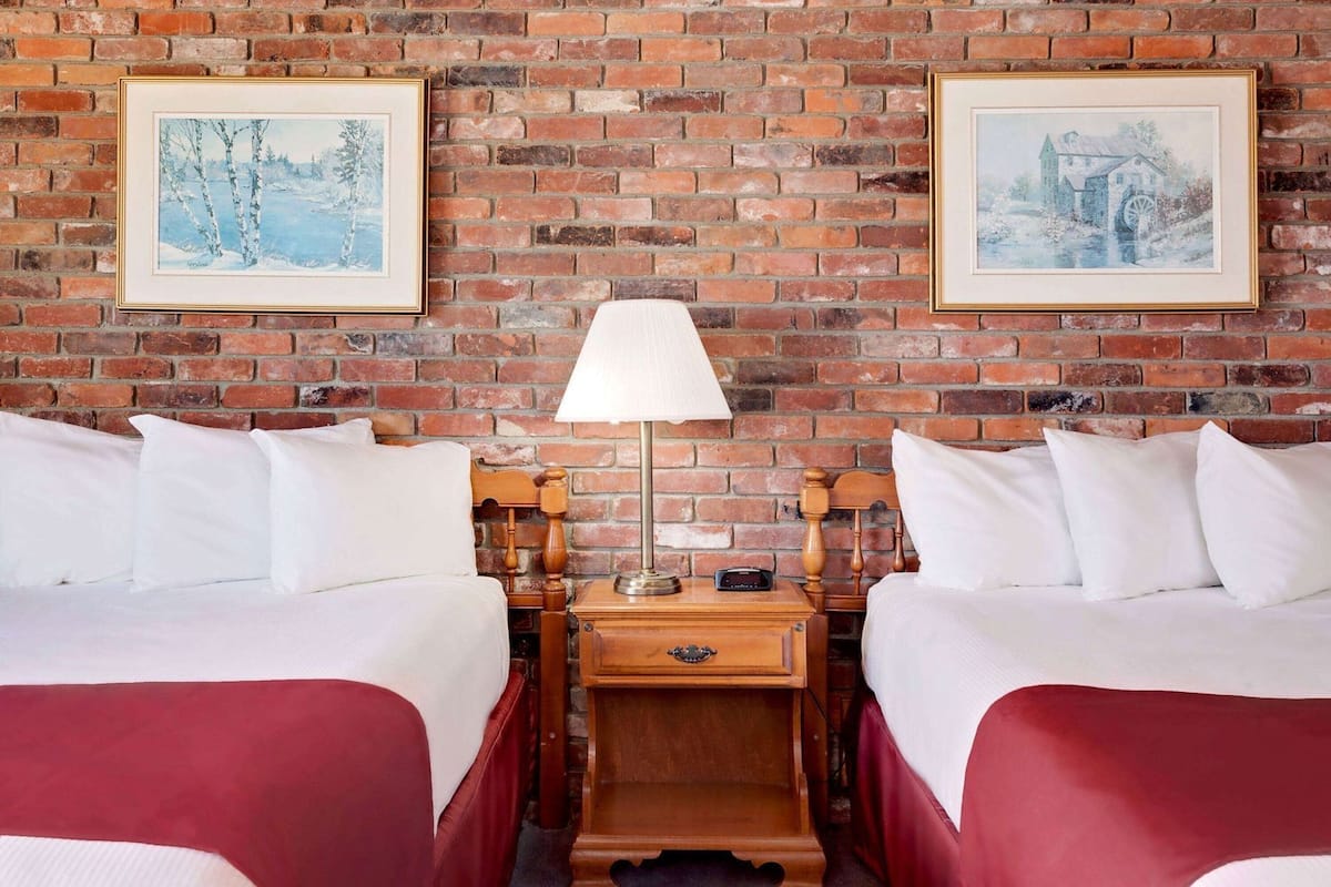 Premium bedding, desk, laptop workspace, blackout drapes