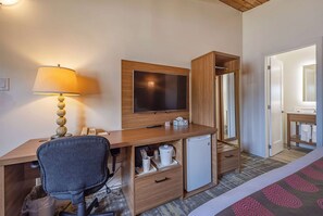 Premium bedding, desk, laptop workspace, blackout drapes