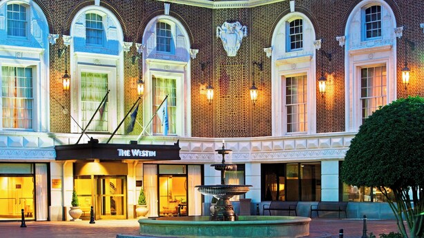 A hotel facade with arched windows, a fountain, and a sign for "The Westin." - The Westin Poinsett Greenville (Greenville)