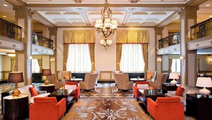 A grand lobby with a chandelier, multiple seating areas, and a checkered floor pattern. - The Westin Poinsett Greenville (Greenville)