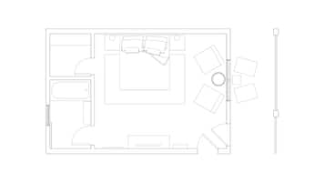 A floor plan of a hotel room with a bathroom, a kitchenette, a seating area, and a bed.
