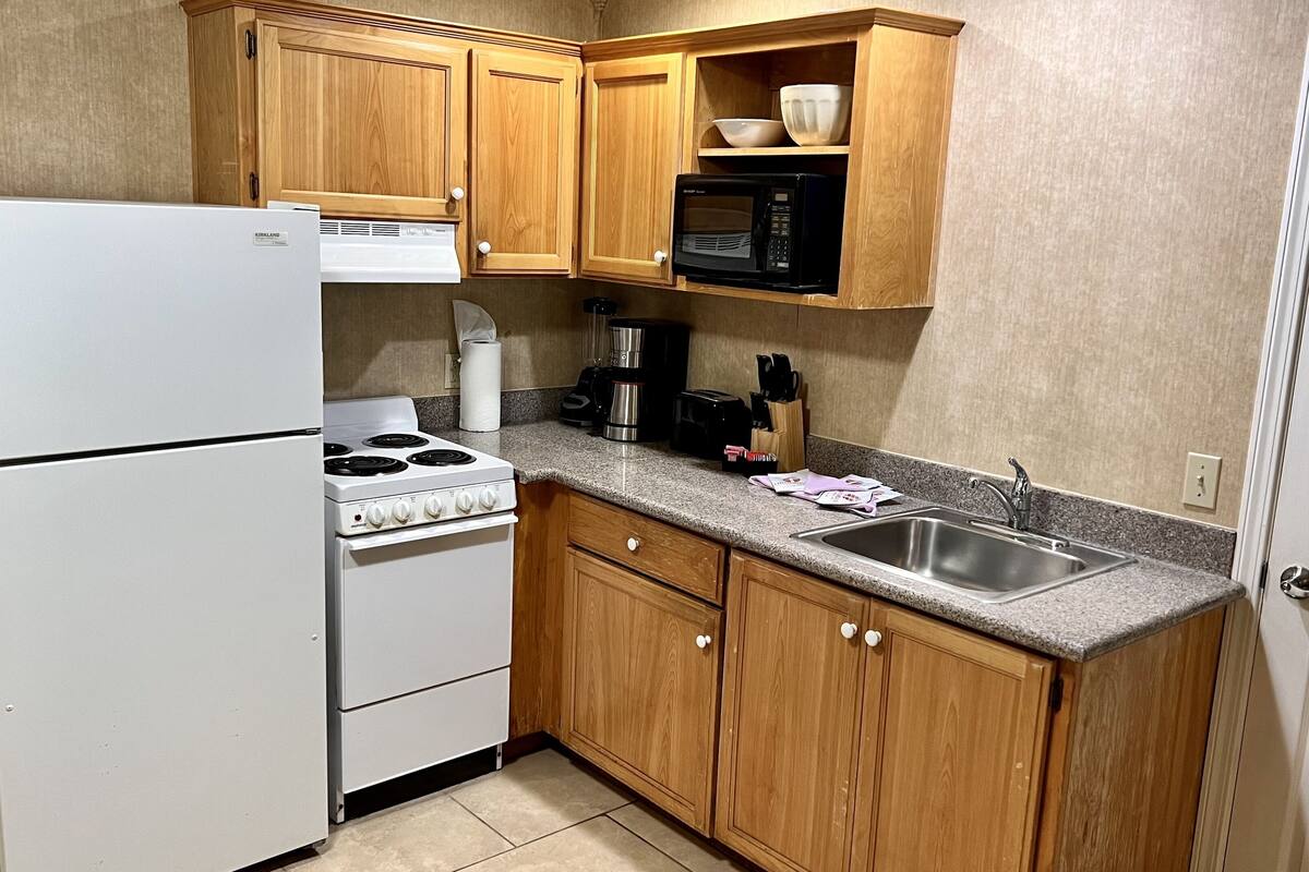 deluxe river view 2 bedroom family suite  | private kitchen | fridge, microwave, coffee/tea maker, toaster