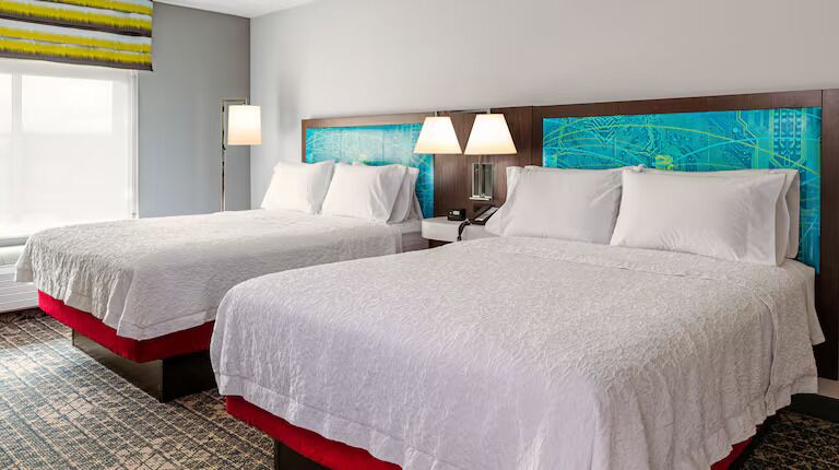 Room, 2 Queen Beds, Refrigerator & Microwave | Desk, laptop workspace, blackout drapes, iron/ironing board