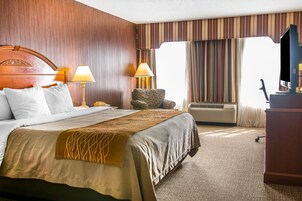 Desk, laptop workspace, blackout drapes, iron/ironing board