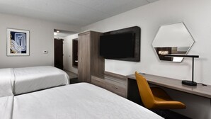 A hotel room with two beds, a desk, a chair, a TV, and a mirror. - Holiday Inn Express Richmond I-64 Short Pump Area by IHG (Richmond)