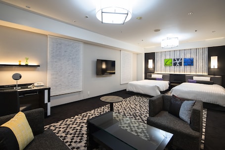 Deluxe Quadruple Room, Non Smoking | Living area | LCD TV, pay movies