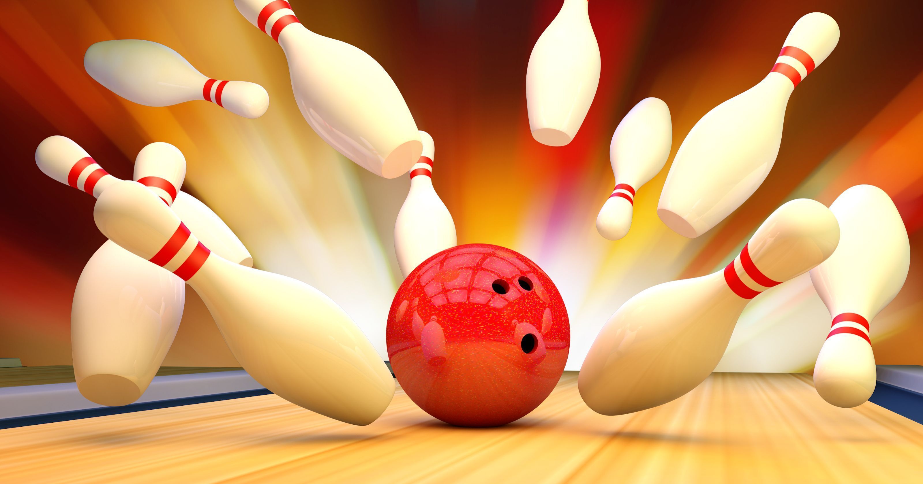 Una bola de boliche en movimiento, con bolos en diferentes momentos del impacto.