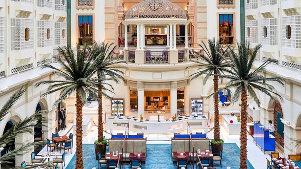 A spacious atrium with a central dome, multiple levels of balconies, and a variety of seating areas. - ITC Maratha Mumbai, a Luxury Collection Hotel, Mumbai (Mumbai)
