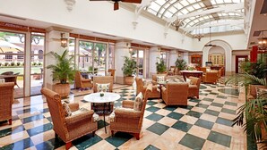 A spacious lobby with checkered flooring, wicker furniture, and large windows allowing natural light. - ITC Maratha Mumbai, a Luxury Collection Hotel, Mumbai (Mumbai)