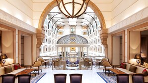 A spacious lobby with a central atrium, seating areas, and a chandelier. - ITC Maratha Mumbai, a Luxury Collection Hotel, Mumbai (Mumbai)