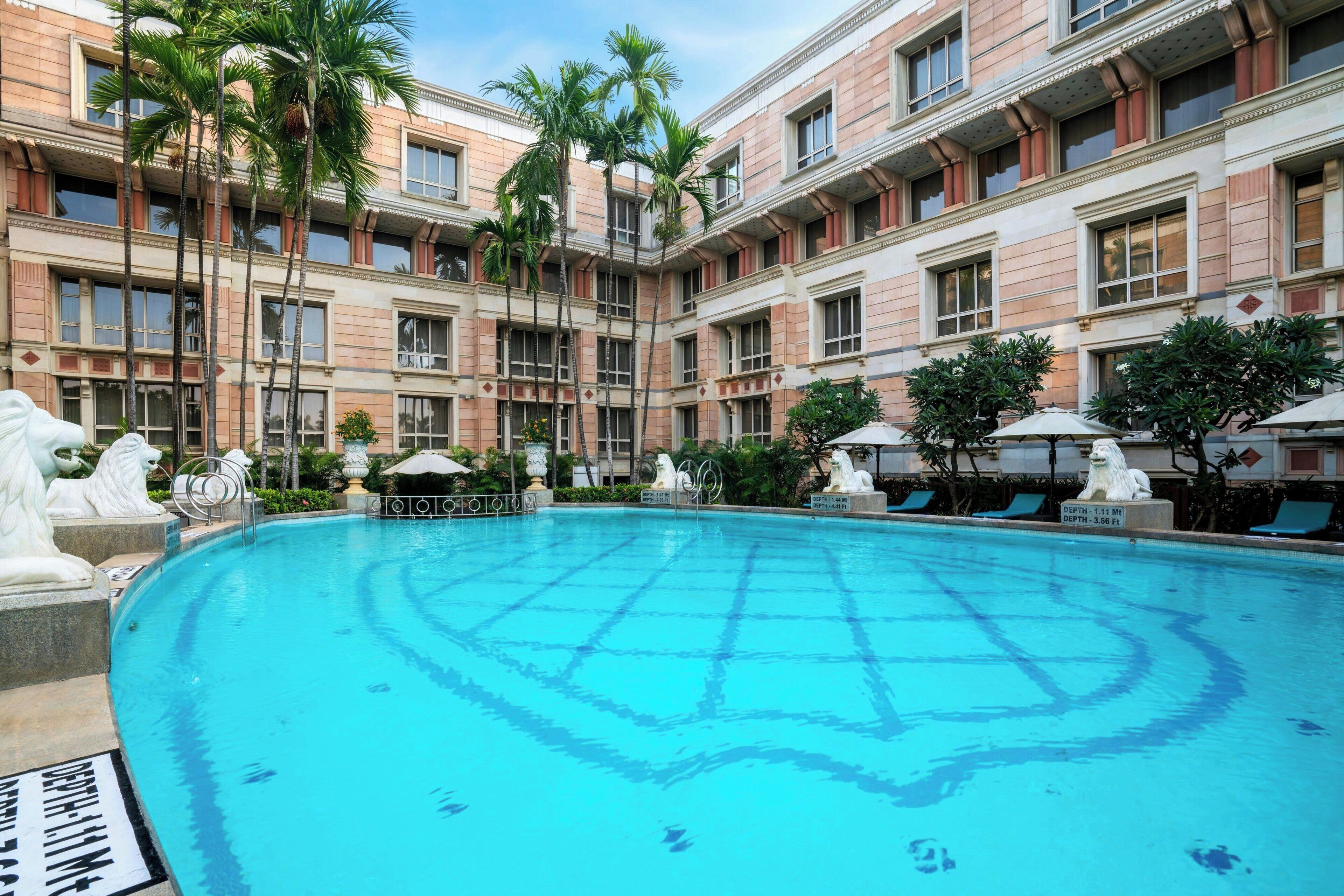 outdoor pool, open 6:00 am to 8:00 pm, pool umbrellas, pool loungers