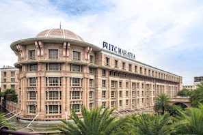 A large, historic building with a dome and the name "ITC MARATHA" on the facade. - ITC Maratha Mumbai, a Luxury Collection Hotel, Mumbai (Mumbai)
