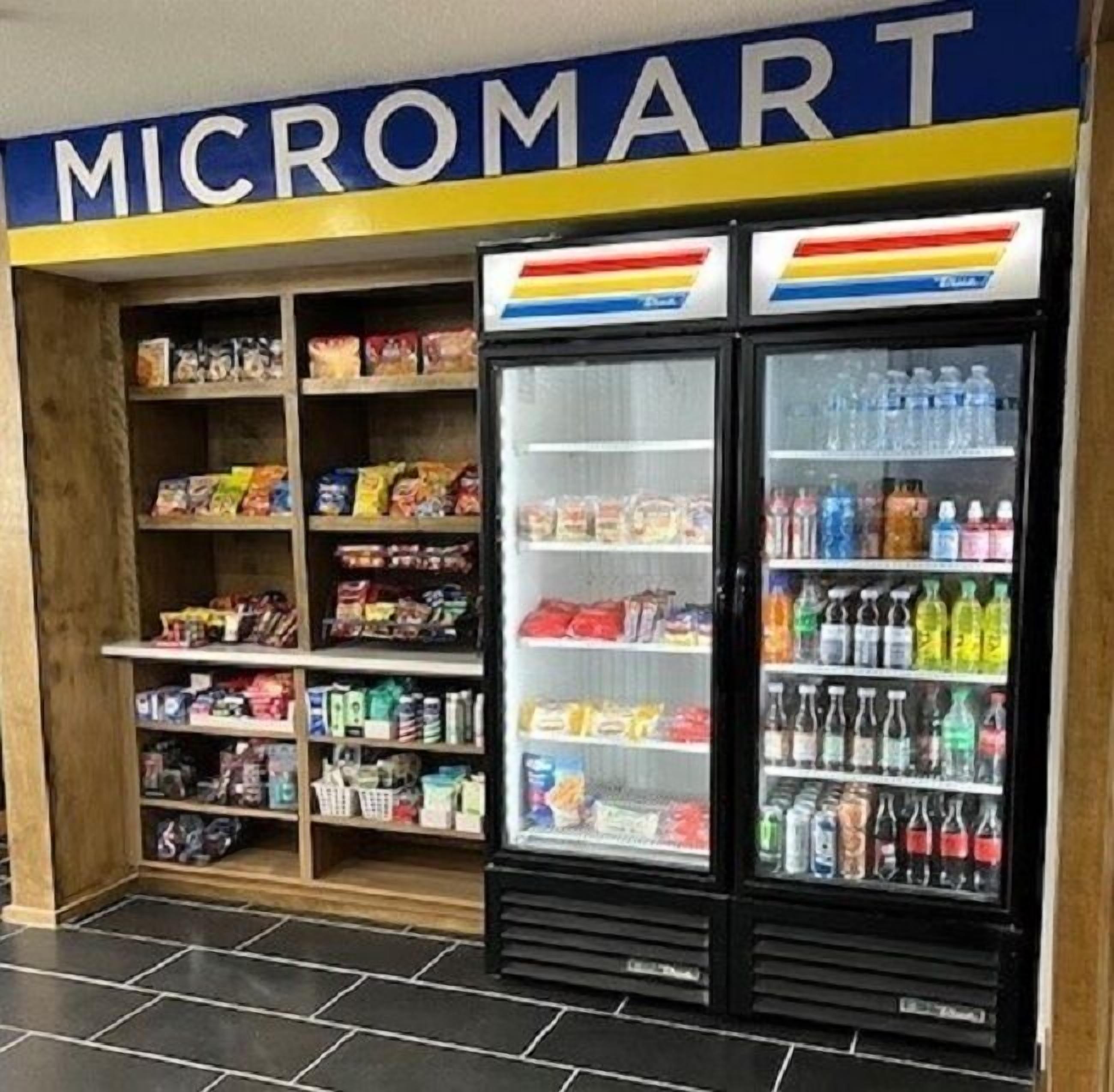 A Micromart store with shelves stocked with snacks and beverages.