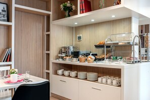 Enjoy a convenient breakfast spread with a variety of options, including eggs, pastries, and bread.