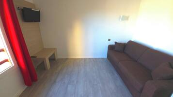 Apartment, 1 Double Bed with Sofa bed (Renovated) | Living area | Flat-screen TV
