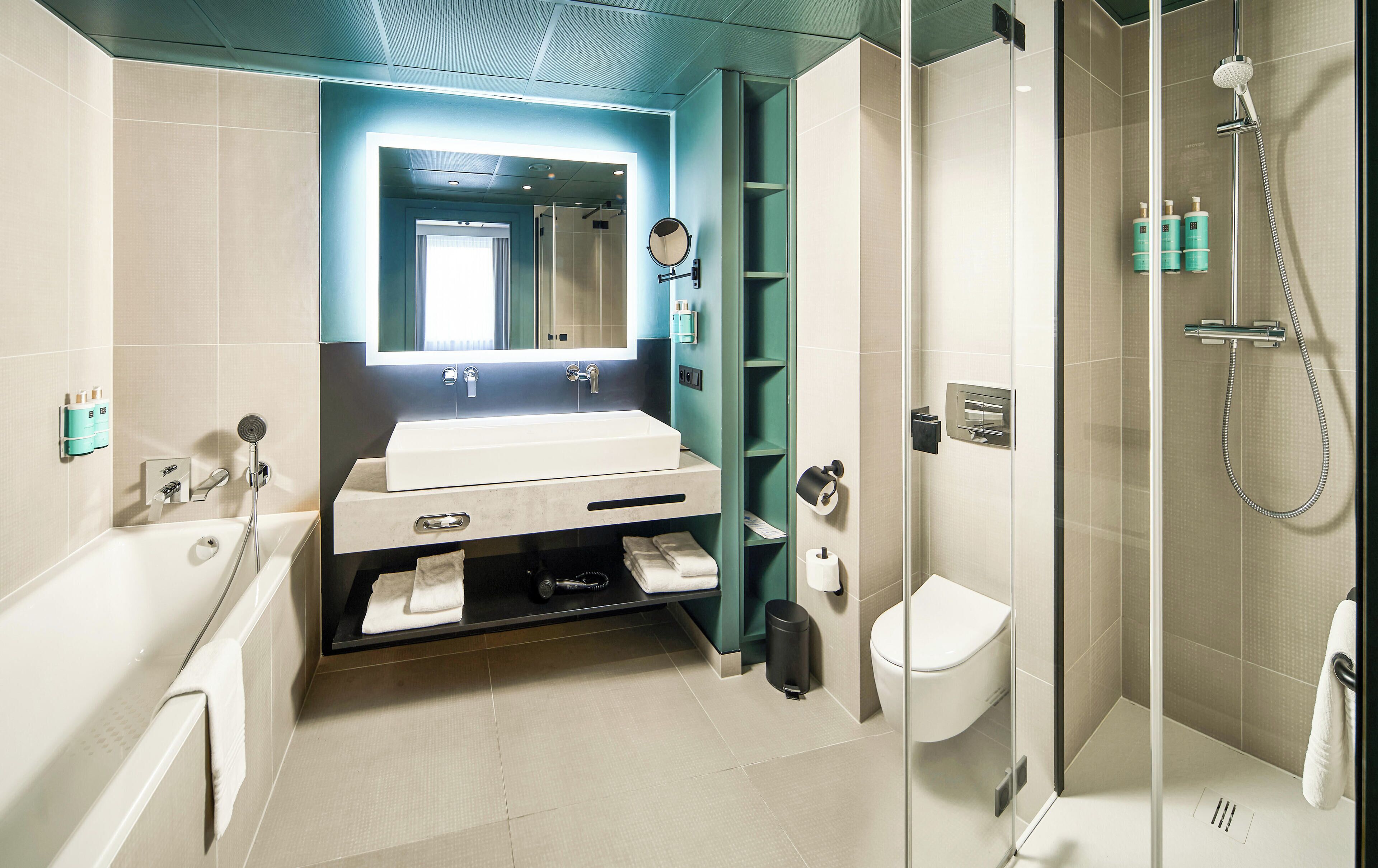 executive suite, 1 queen bed with sofa bed | bathroom | eco-friendly toiletries, hair dryer, towels, soap