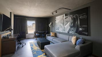 Signature Suite | Living area | 65-inch LED TV with cable channels