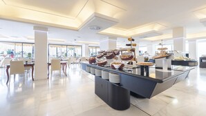 A modern breakfast buffet with a variety of food items and a clean, spacious layout. - Hotel Palma Bellver Affiliated by Meliá (Palma de Mallorca)
