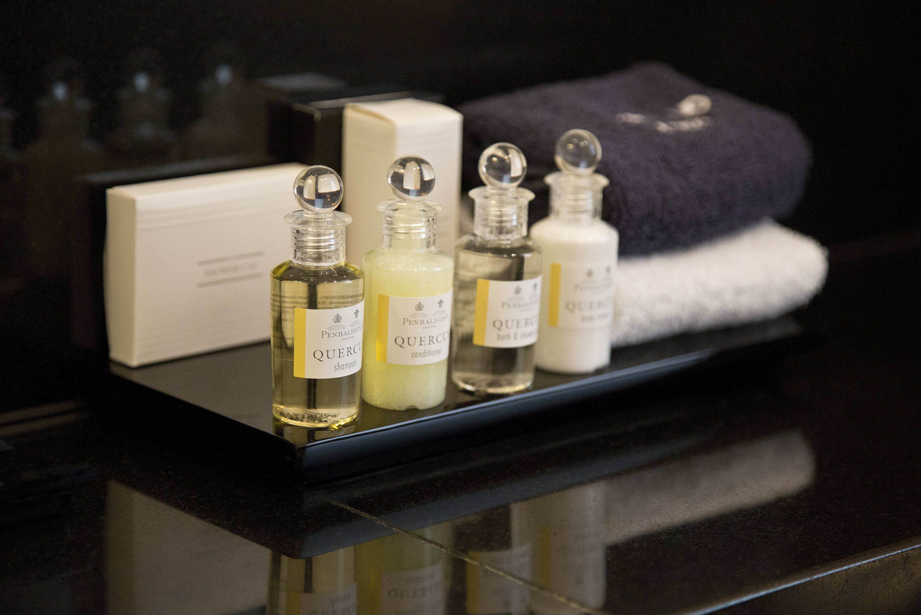 designer toiletries, hair dryer, bathrobes, slippers