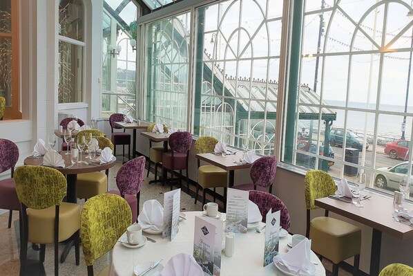 Enjoy a casual dining experience with a view of the sea from our spacious dining area.