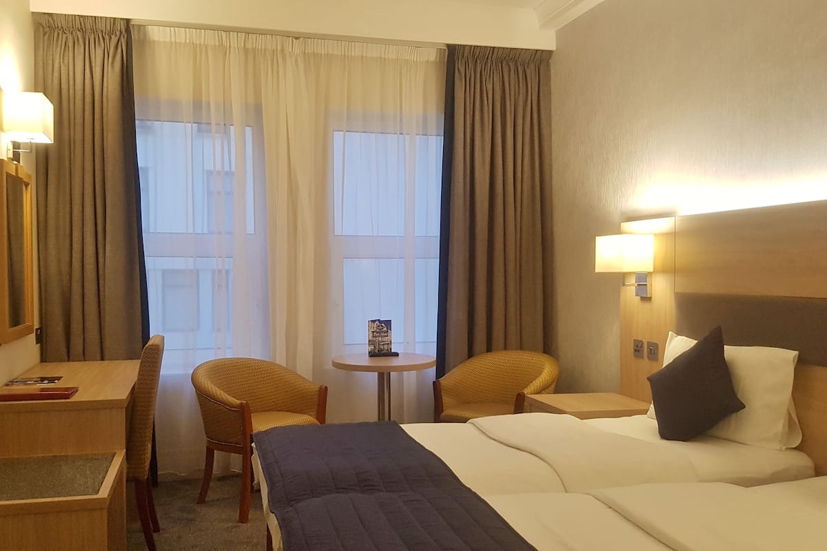 Classic Twin Room | Desk, blackout drapes, iron/ironing board, free WiFi
