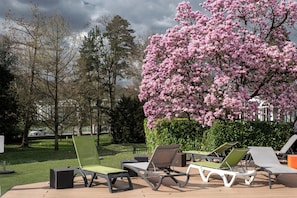 Indoor pool, outdoor pool, pool umbrellas, pool loungers
