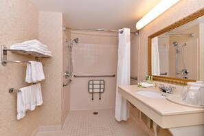 A bathroom with a shower, a sink, and a mirror. - Holiday Inn Express Portland West/Hillsboro by IHG (Hillsboro)