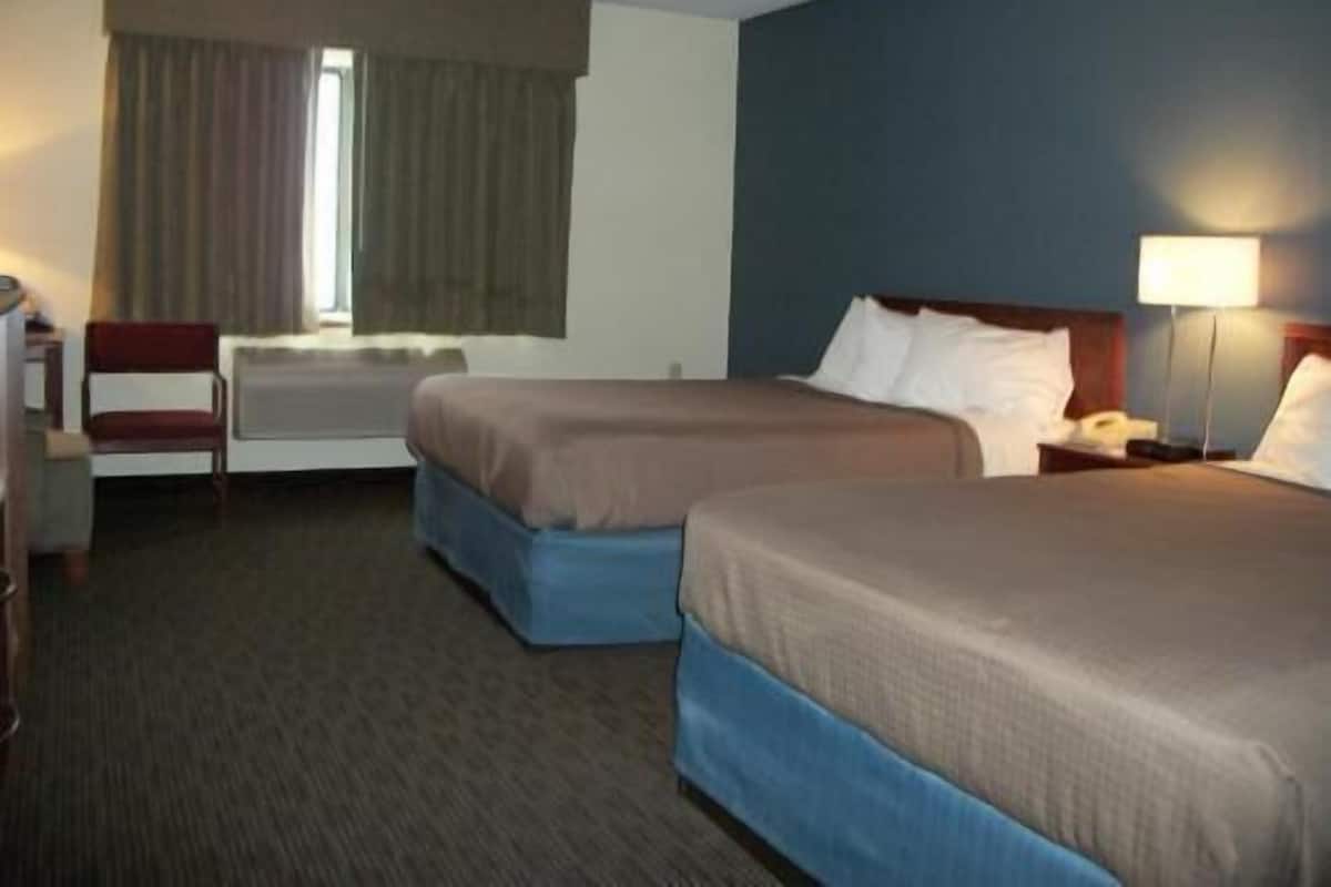 Desk, blackout drapes, iron/ironing board, rollaway beds