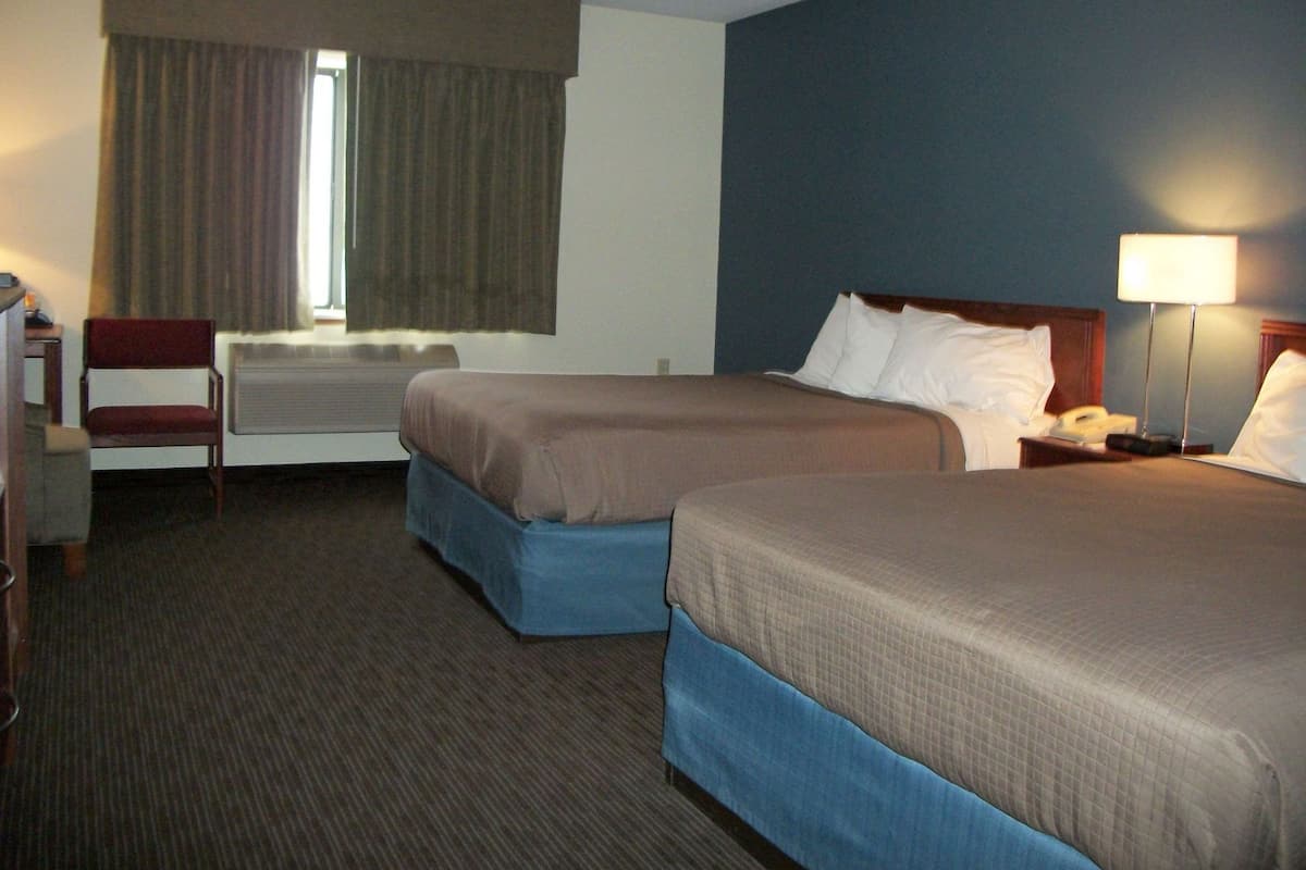 Desk, blackout drapes, iron/ironing board, rollaway beds