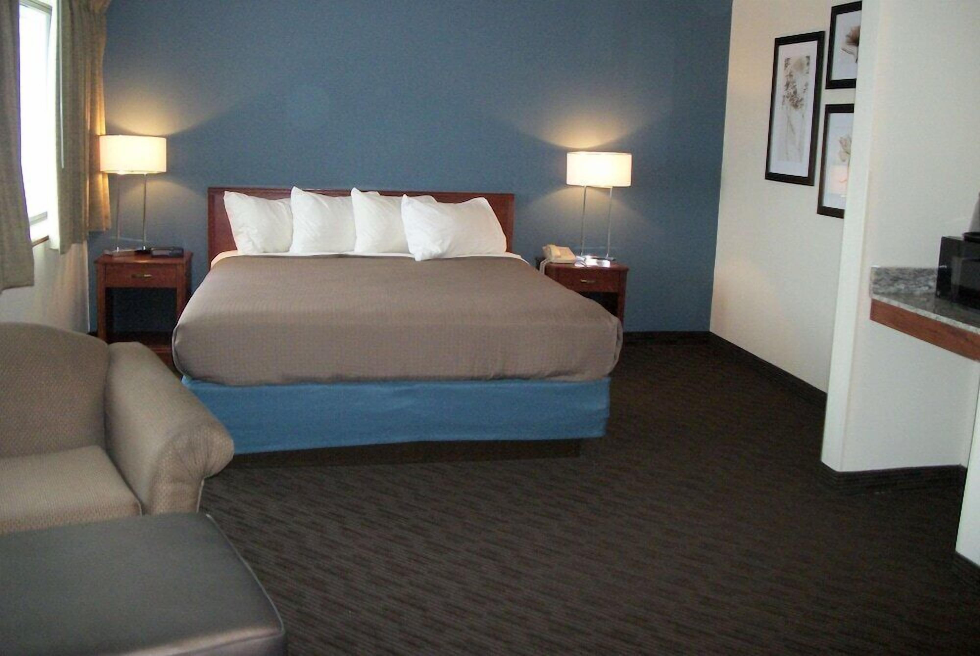 Desk, blackout drapes, iron/ironing board, rollaway beds