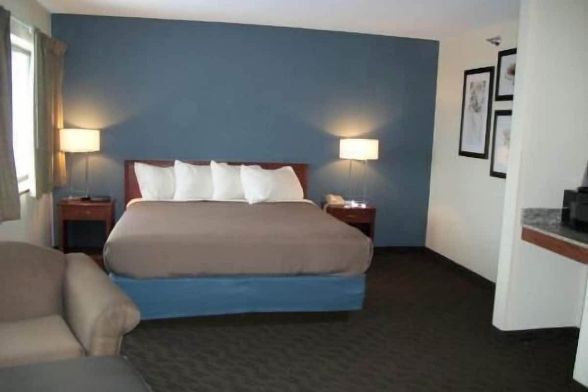 Desk, blackout drapes, iron/ironing board, rollaway beds
