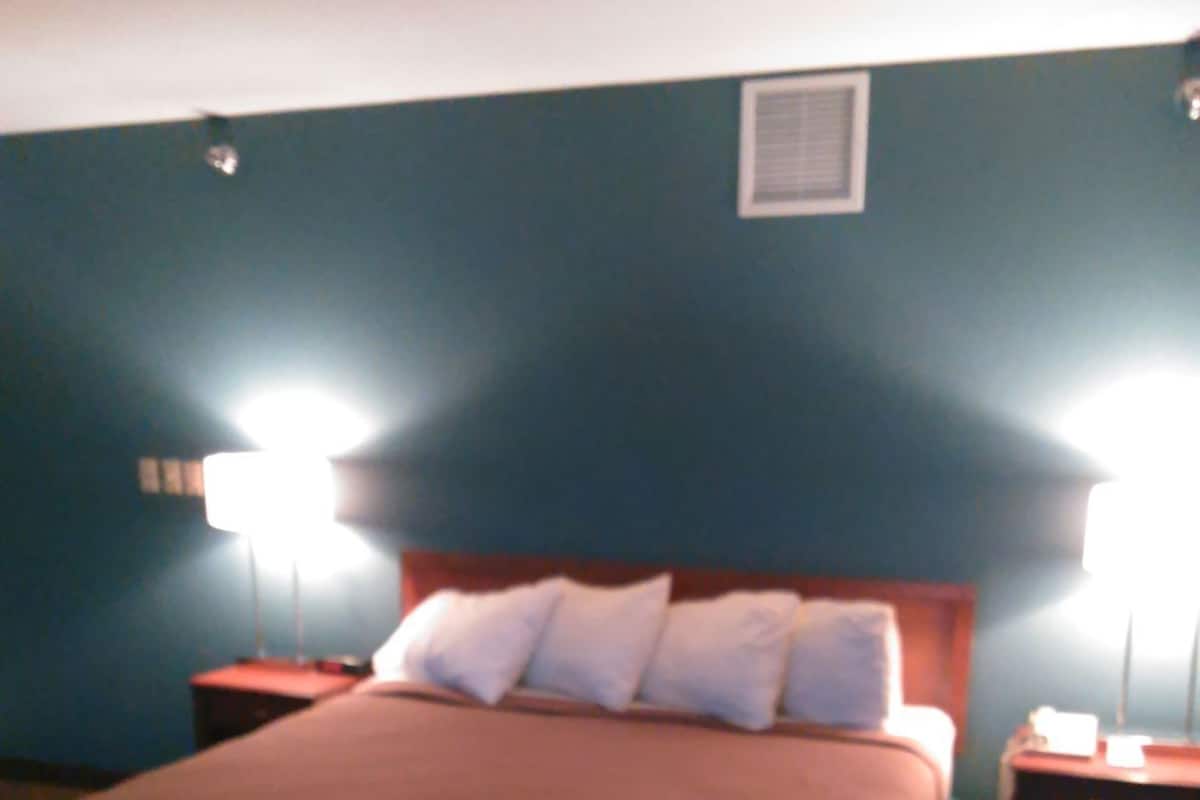 Desk, blackout drapes, iron/ironing board, rollaway beds