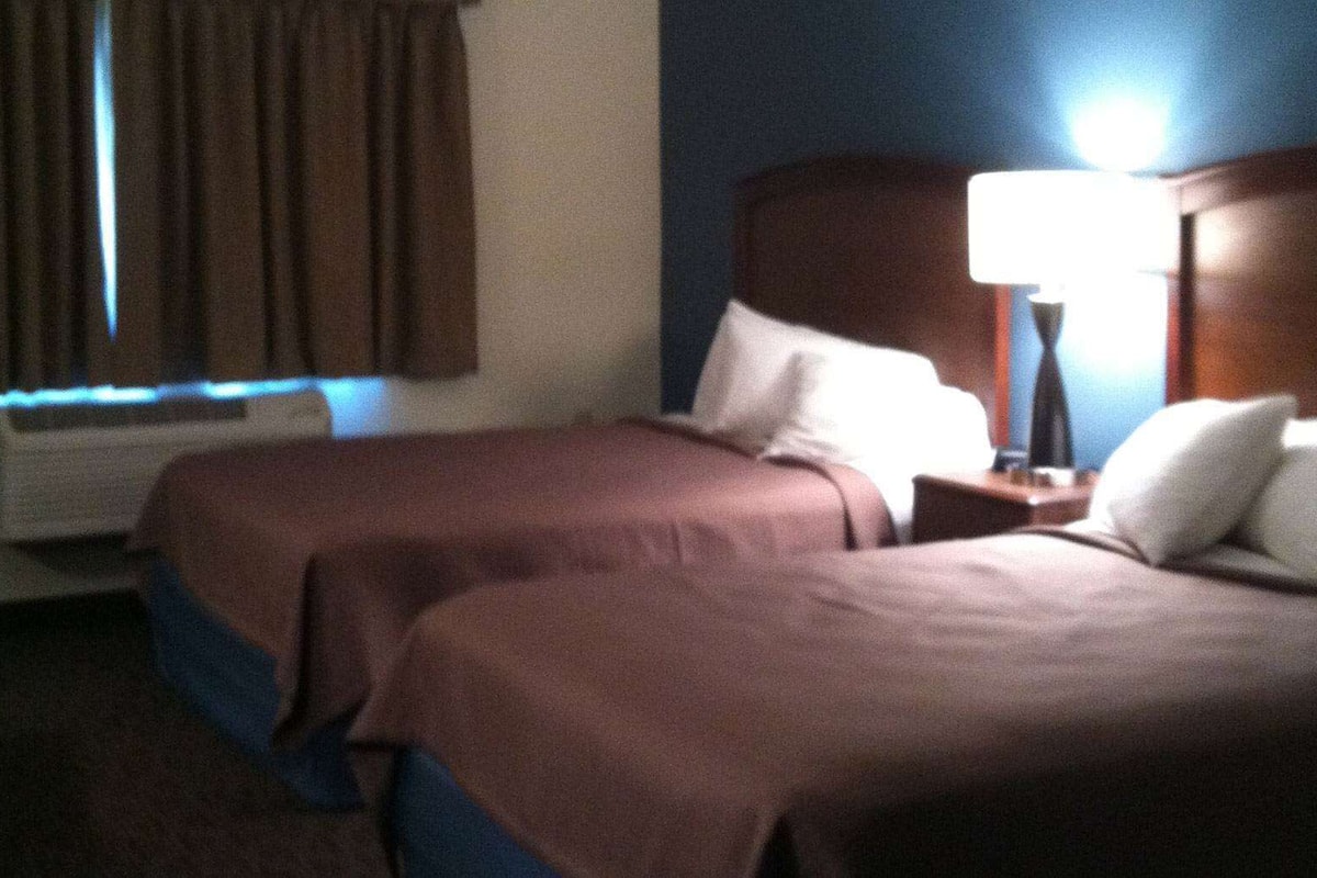 Desk, blackout curtains, iron/ironing board, rollaway beds
